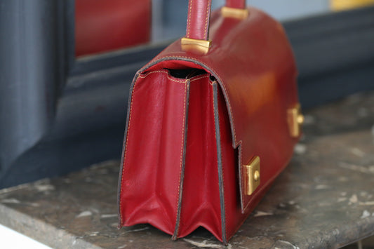 Sac à main Hermès en cuir rouge modèle Piano