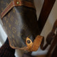 Louis Vuitton sac à main modèle Saumur en toile et cuir