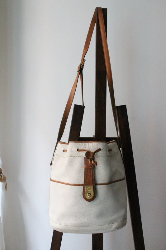 Sac à main Lancel modèle seau en cuir blanc et marron