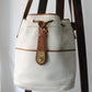 Sac à main Lancel modèle seau en cuir blanc et marron