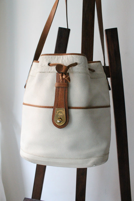 Sac à main Lancel modèle seau en cuir blanc et marron