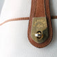Sac à main Lancel modèle seau en cuir blanc et marron