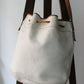Sac à main Lancel modèle seau en cuir blanc et marron