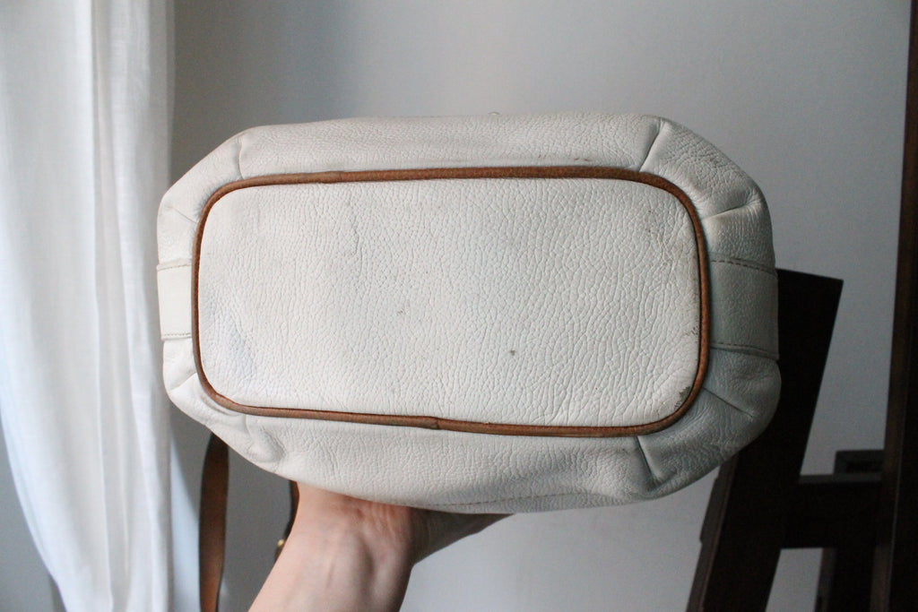 Sac à main Lancel modèle seau en cuir blanc et marron