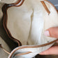 Sac à main Lancel modèle seau en cuir blanc et marron