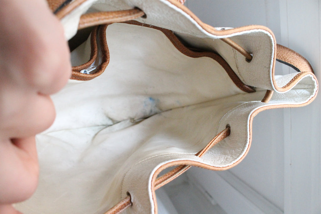 Sac à main Lancel modèle seau en cuir blanc et marron