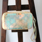 Louis Vuitton pochette Volga en PVC embossé Prism Monogram