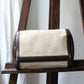 Trousse de toilette Hermès en toile beige et cuir marron