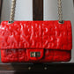 Chanel sac à main modèle 2.55 puzzle en cuir vernis