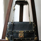 Louis Vuitton sac à main modèle Talentueux en cuir noir