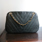 Chanel sac à main modèle Chevron en cuir noir vintage