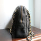 Chanel sac à main modèle caméra en cuir noir