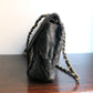 Chanel sac à main modèle "2.55" vintage à double rabat en cuir noir
