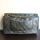 Chanel sac à main modèle "2.55" vintage à double rabat en cuir noir