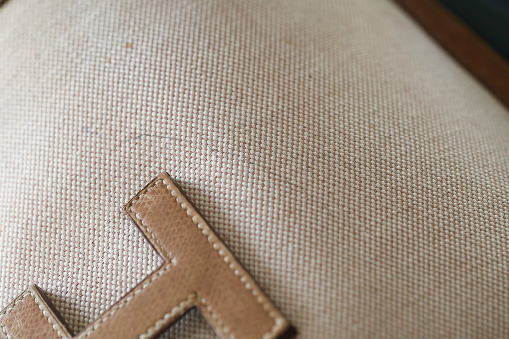 Hermès pochette en toile et cuir grainé modèle Jige