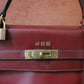 Hermès sac à main modèle Kelly 35 vintage en cuir box bordeaux