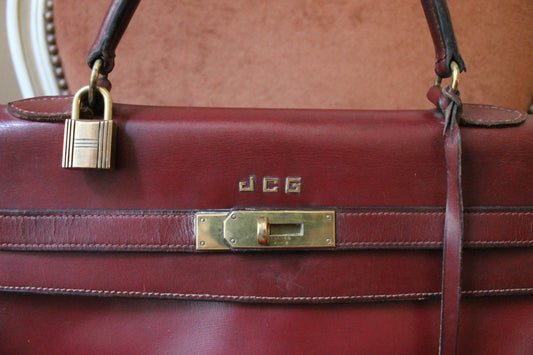 Hermès sac à main modèle Kelly 35 vintage en cuir box bordeaux
