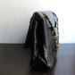 Chanel sac à main modèle "2.55" vintage à double rabat en cuir noir