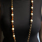 Chanel collier Gripoix en métal et perles marrons blanches