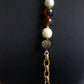 Chanel collier Gripoix en métal et perles marrons blanches
