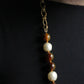 Chanel collier Gripoix en métal et perles marrons blanches