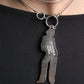 Chanel collier en métal argenté avec pendentif représentant coco chanel