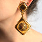 Chanel boucles d’oreilles pendantes à clip en métal doré cc