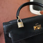 Hermès sac à main modèle Kelly 32 en cuir box noir