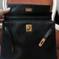 Hermès sac à main modèle Kelly 32 en cuir box noir