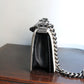 Chanel sac à main modèle Boy 20 cm en veau glacé noir et ivoire