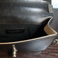Chanel sac à main modèle Boy 20 cm en veau glacé noir et ivoire