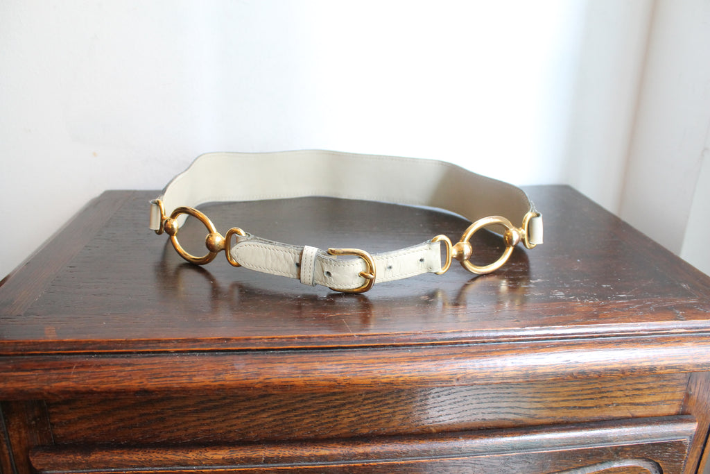 Hermès ceinture taille haute en cuir beige à décor d'anneaux dorés