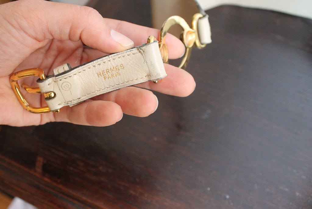 Hermès ceinture taille haute en cuir beige à décor d'anneaux dorés