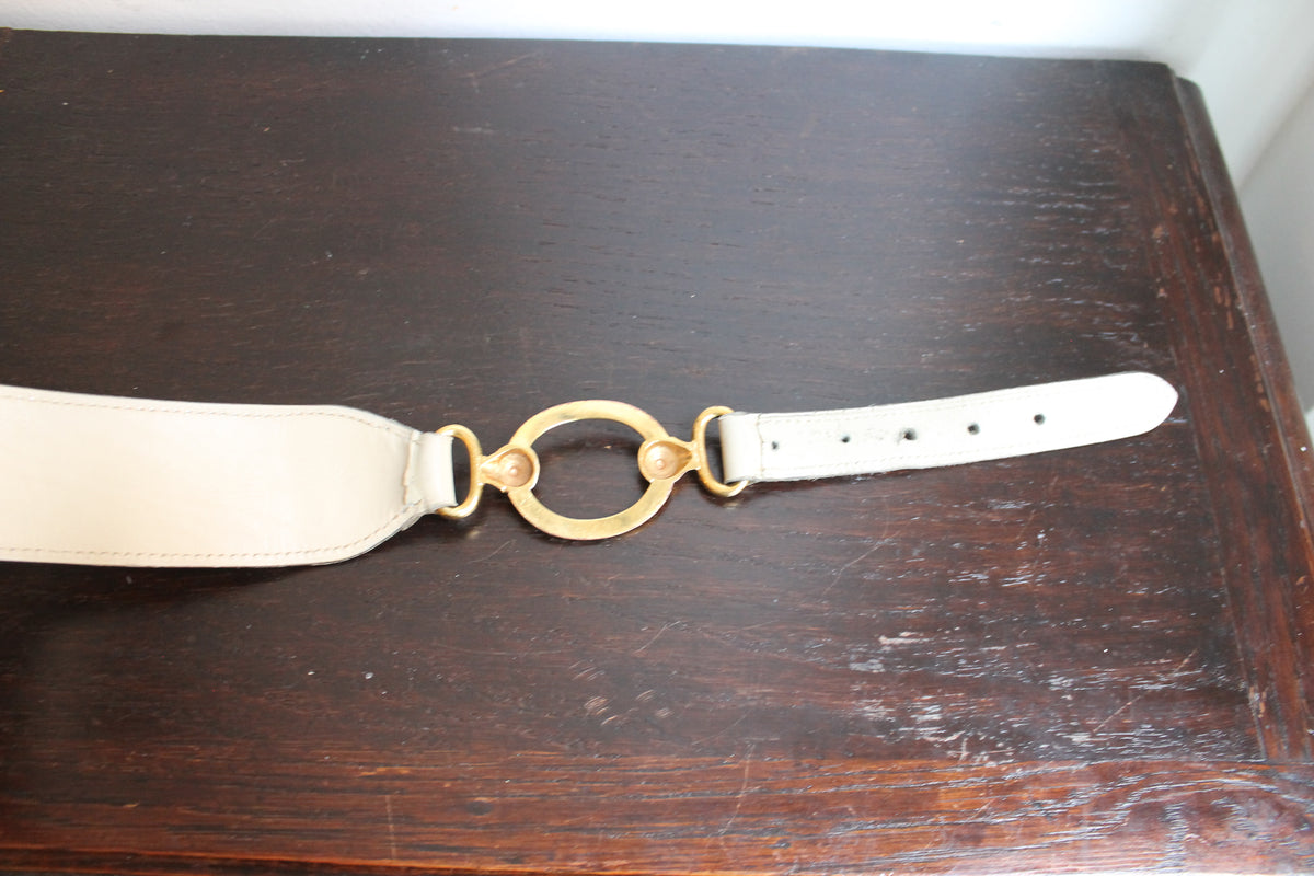 Hermès ceinture taille haute en cuir beige à décor d'anneaux dorés
