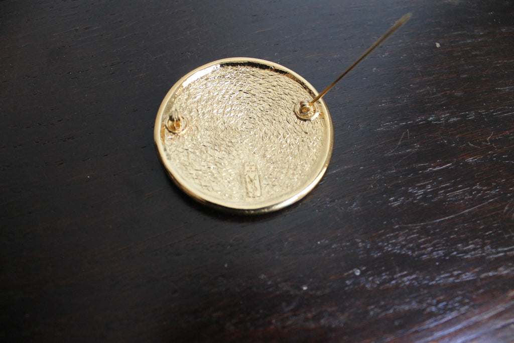 Yves Saint Laurent broche à motif aztèque en métal doré