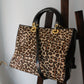 Dior sac à main Lady Dior en cuir verni et fausse fourrure léopard
