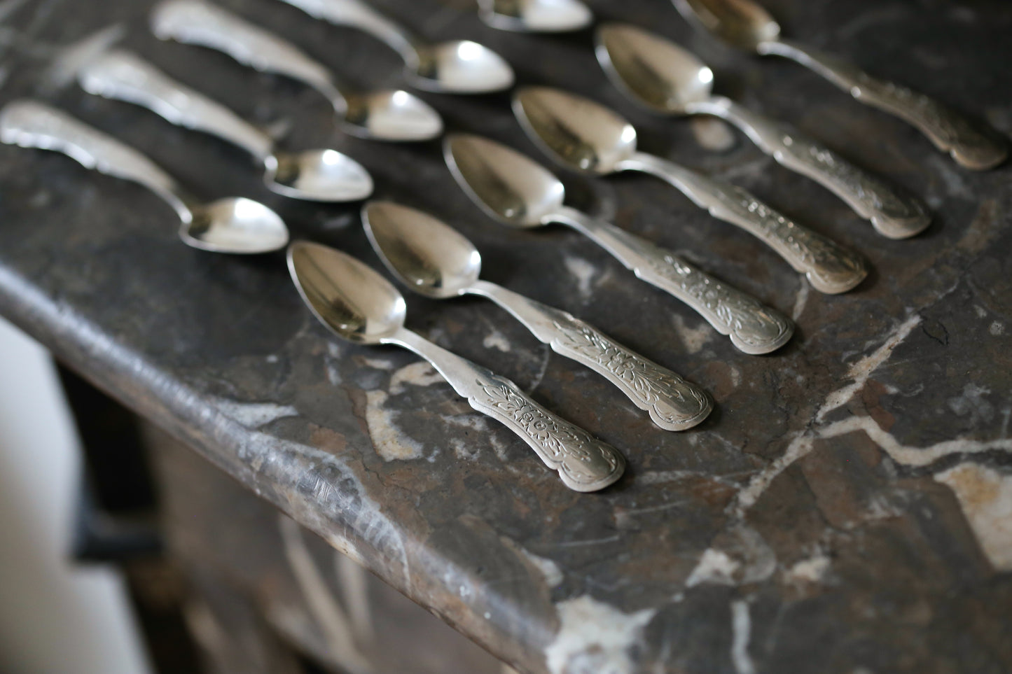 12 silver mocha spoons with flower decorations dating from 1916